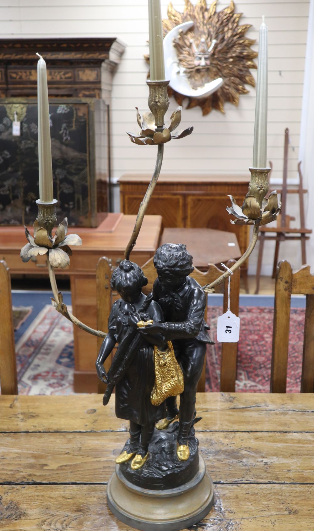 A spelter figural three branch candelabra, height 71cm